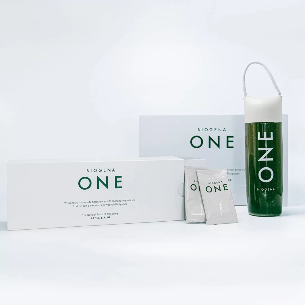 A complete Biogena One product set featuring two cream-white supplement boxes, two individual powder sachets, and a transparent shaker bottle filled with a dark green wellness drink.